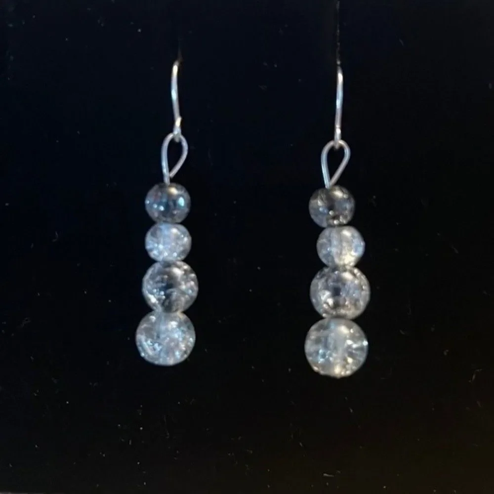 Handcrafted silver tone and glass bead earrings.